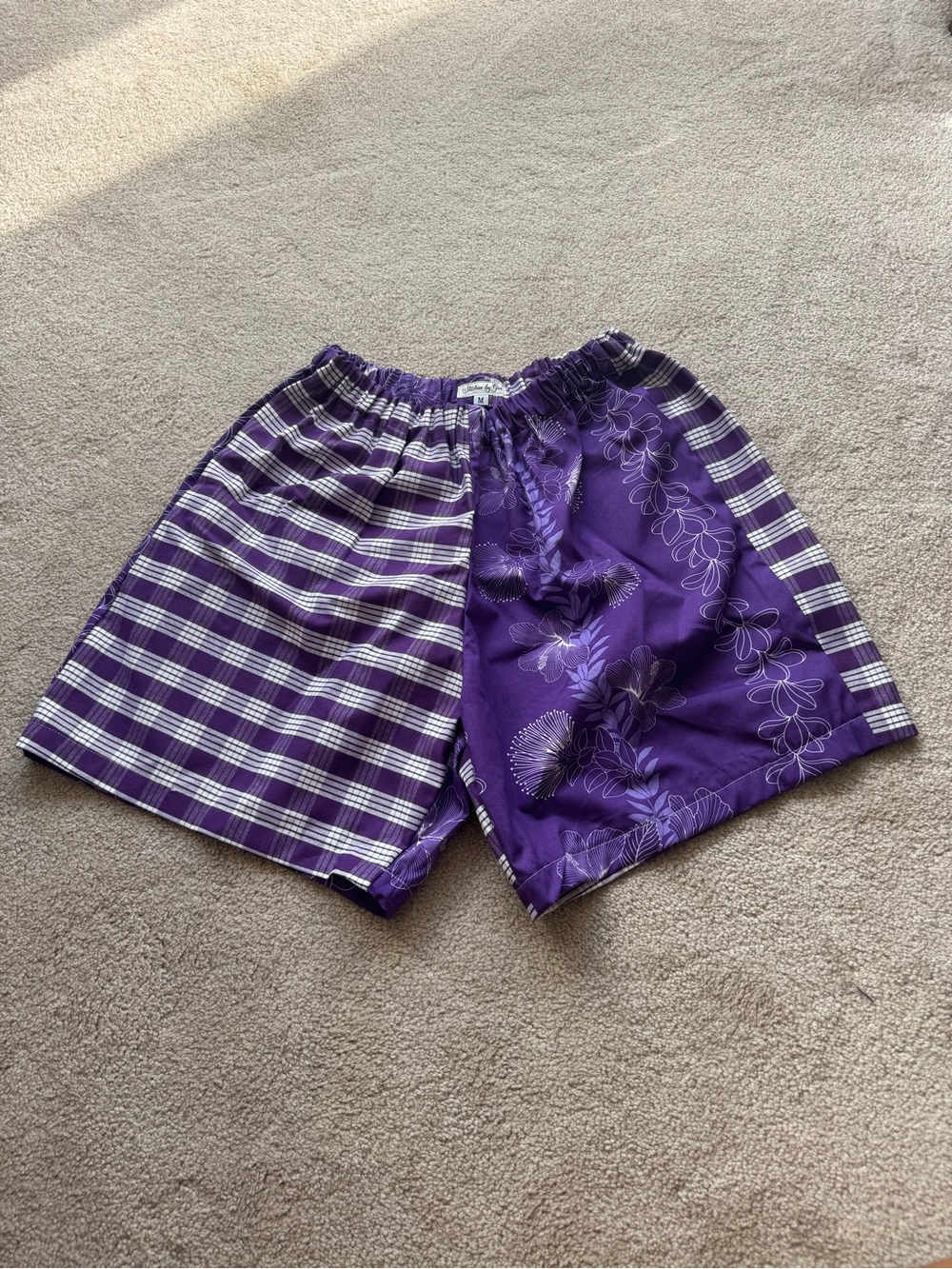 Purple and white plaid/palaka shorts with white floral/aloha print